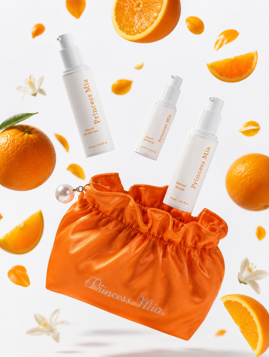 Princess Mia Retinol Skincare Bundle featuring Retinol Serum, Retinol Moisturizer, and Retinol Eye Serum with an orange satin makeup bag, surrounded by fresh oranges on a clean white luxury skincare background.