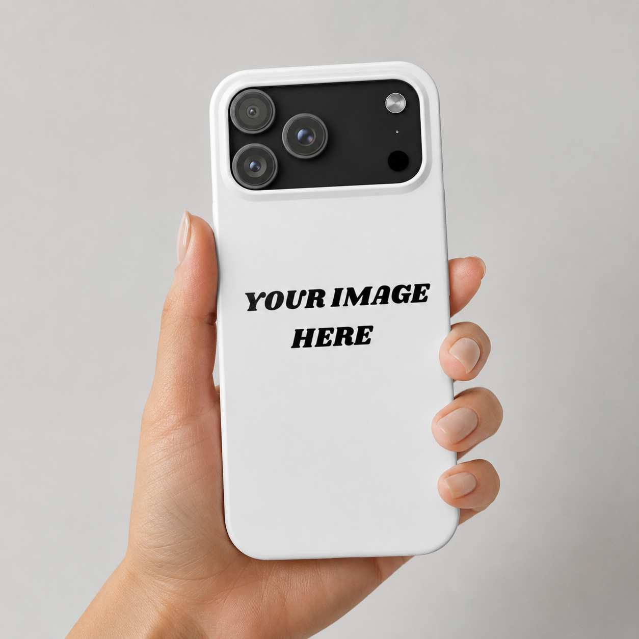 Hand holding a white phone case with 'Your Image Here' text on a gray background